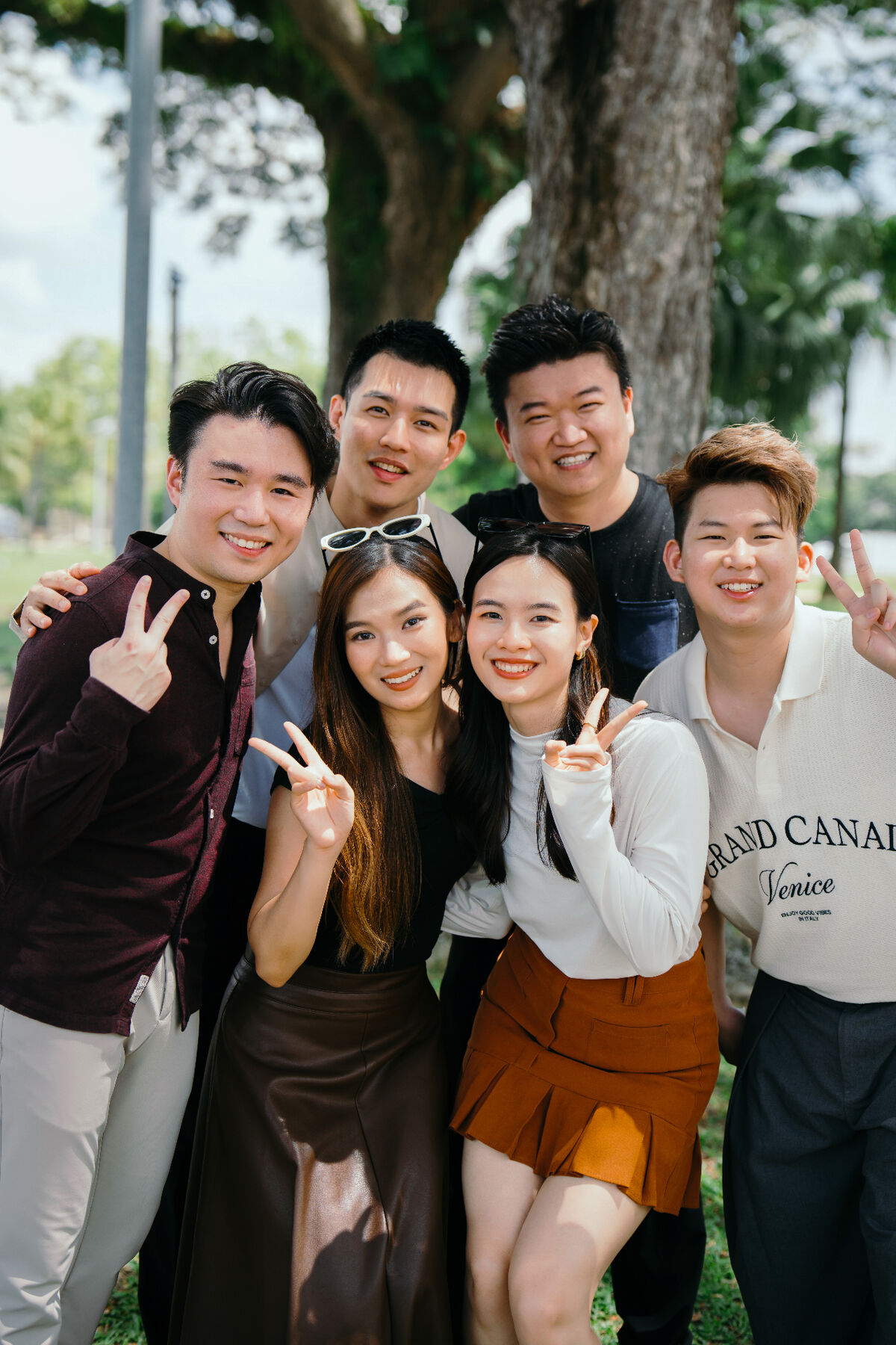 Kevin Lee team — close group portrait under the trees