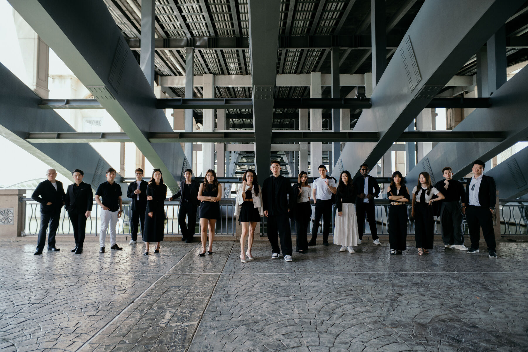 Kevin Lee team — formal portrait under the bridge